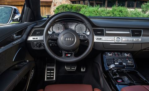 Motor vehicle, Steering part, Mode of transport, Automotive design, Product, Steering wheel, Automotive mirror, Brown, Center console, Speedometer, 