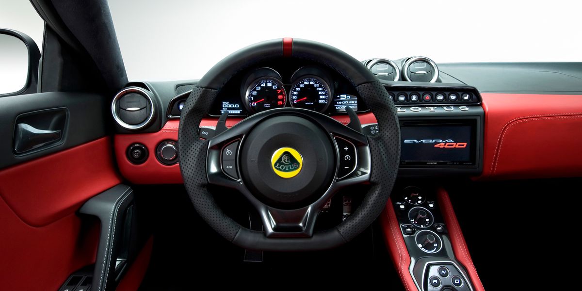 Motor vehicle, Steering part, Mode of transport, Automotive design, Steering wheel, Red, Center console, Speedometer, Car, Luxury vehicle, 