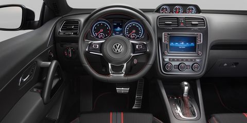 Motor vehicle, Steering part, Automotive design, Mode of transport, Product, Steering wheel, Center console, Vehicle audio, White, Red, 