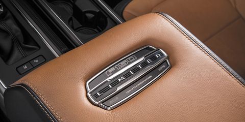 Brown, Automotive design, Tan, Personal luxury car, Leather, Luxury vehicle, Brand, Carbon, Center console, Gloss, 