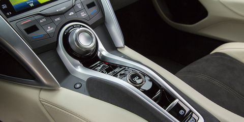 Motor vehicle, Automotive design, Steering part, White, Center console, Car, Steering wheel, Vehicle audio, Luxury vehicle, Gear shift, 
