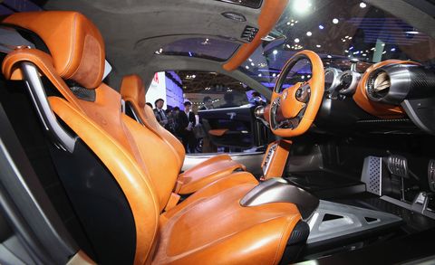 Motor vehicle, Automotive design, Orange, Steering part, Steering wheel, Car seat, Luxury vehicle, Personal luxury car, Concept car, Car seat cover, 