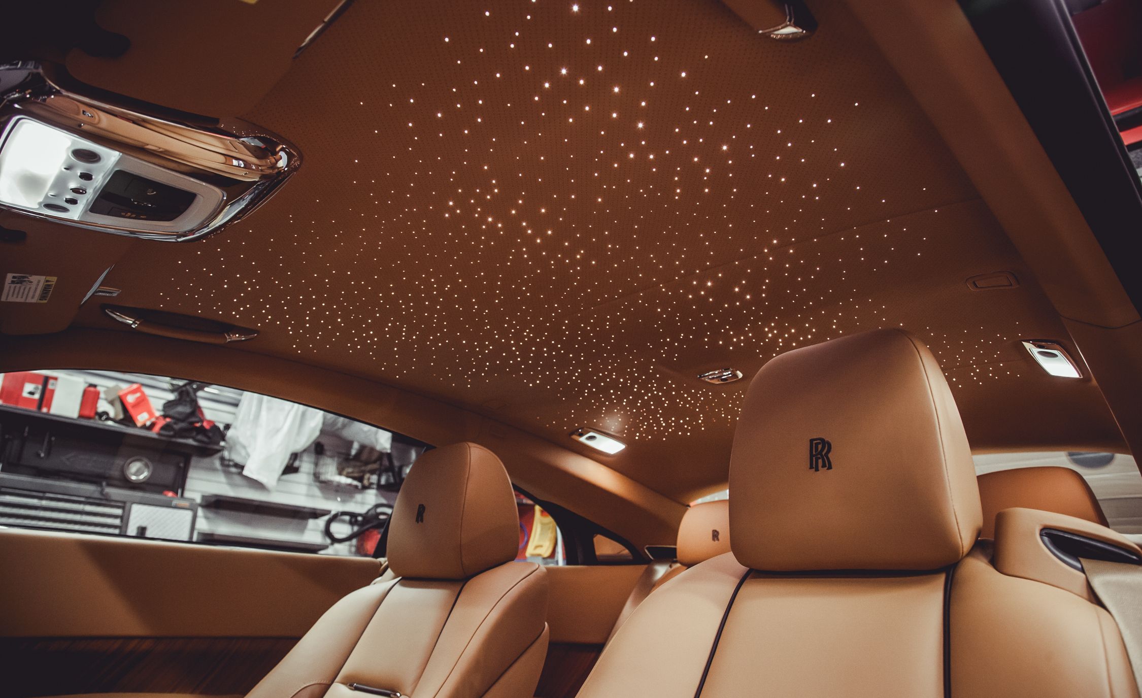 RollsRoyce Motor Cars  The Wraiths Starlight headliner is made of 1340  gleaming fibre optics painstakingly installed by hand As you would expect  from RollsRoyce they can be sewn into the constellation