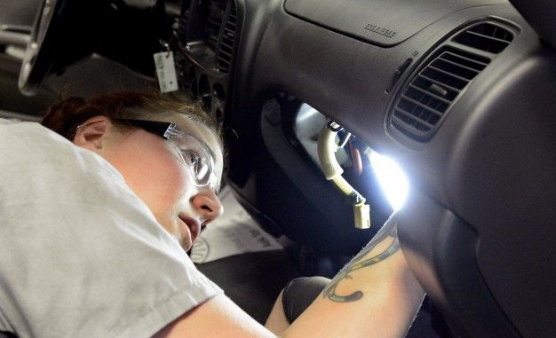 woman repairing takata airbag