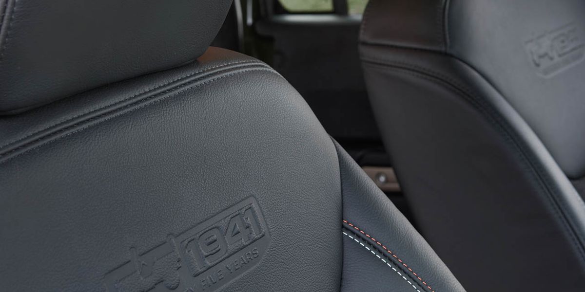 Grey, Car seat, Head restraint, Vehicle door, Automotive window part, Leather, Car seat cover, 