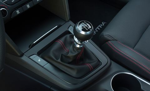 Motor vehicle, Automotive design, Center console, Personal luxury car, Gear shift, Luxury vehicle, Steering part, Carbon, Car seat, Steering wheel, 