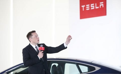 Tesla Trucks Solar Roofs And Car Sharing Part Of Musk S Second Elon Musk Tesla Sign