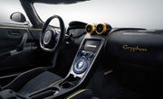Motor vehicle, Mode of transport, Automotive design, Steering part, Steering wheel, Center console, Vehicle audio, Speedometer, Personal luxury car, Luxury vehicle, 