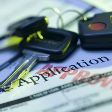 car keys on top of loan application