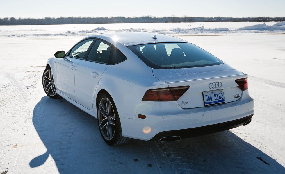 2017 white audi a7 parked on a snow covered lot