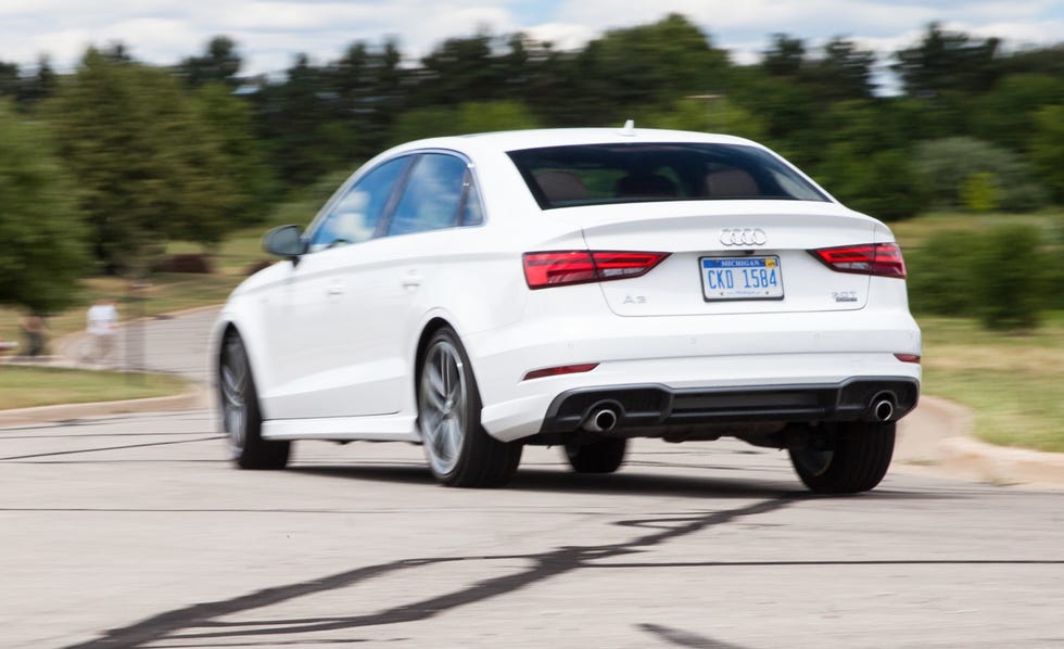 2017 white audi a3 sedan rounding a corner