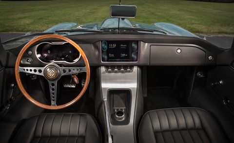Land vehicle, Vehicle, Car, Steering wheel, Center console, Steering part, Gear shift, Classic car, Coupé, Jaguar, 