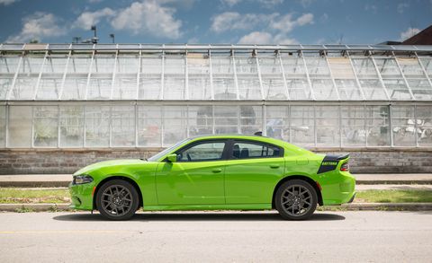 2017 dodge charger parked near a greenhouse