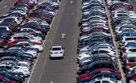 Cars in a large parking lot. According to a recent McKinsey