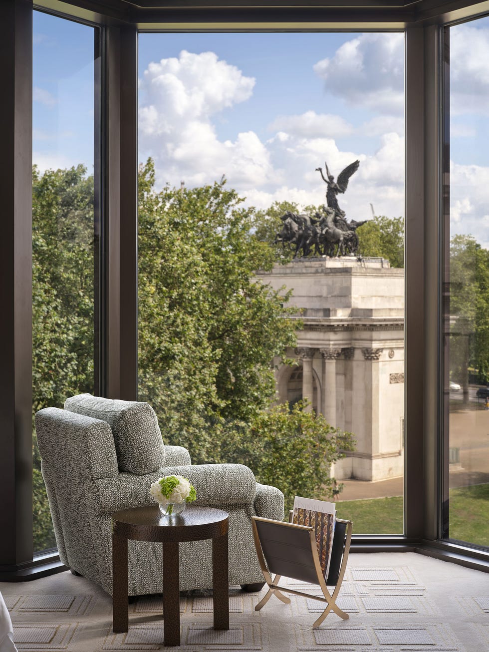 a statue of a person on a horse on a chair in a room