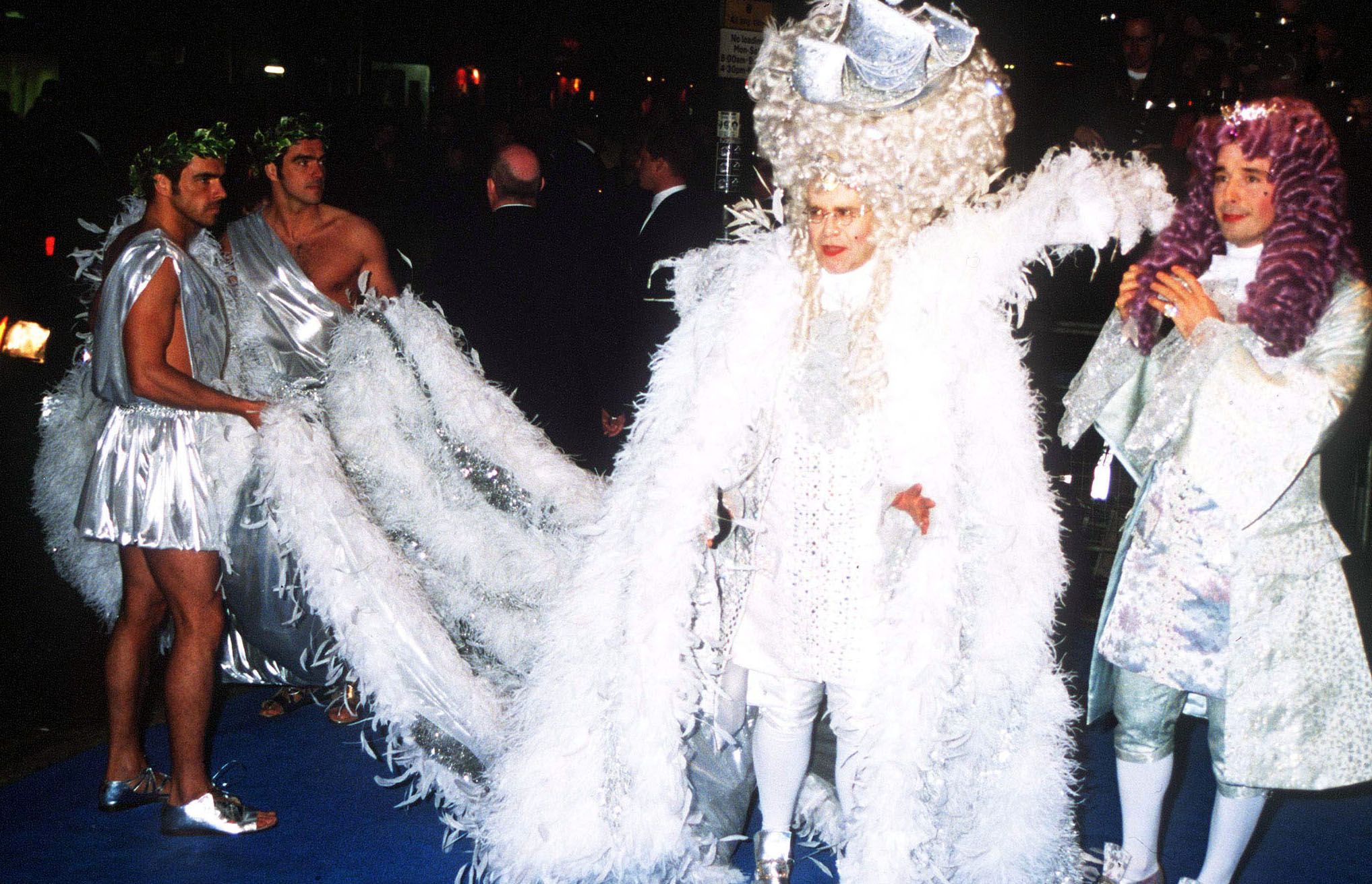 Elton John and David Furnish at John's 50th birthday party in London, April 1997