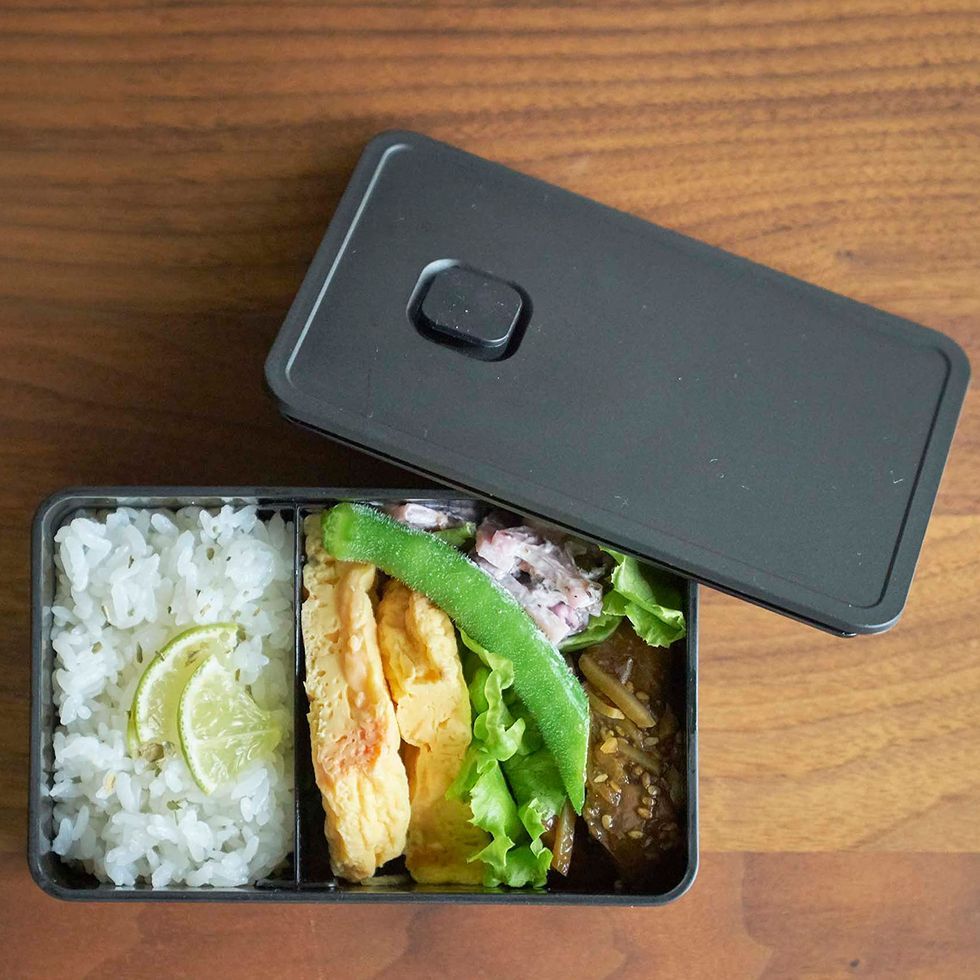 a cell phone next to a plate of food