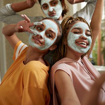 friends posing with face masks