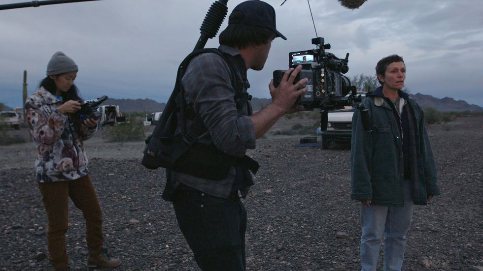 from l r directorwriter chloé zhao, director of photography joshua james richards and frances mcdormand on the set of nomadland photo courtesy of searchlight pictures © 2020 20th century studios all rights reserved