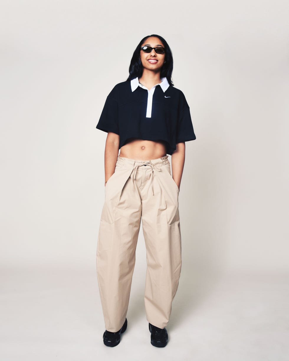 fashionable outfit featuring a cropped black polo and beige loosefit pants fashionable outfit featuring a cropped black polo and beige loosefit pants