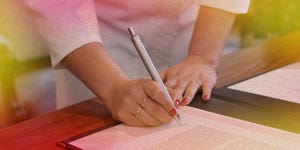 woman signing paperwork