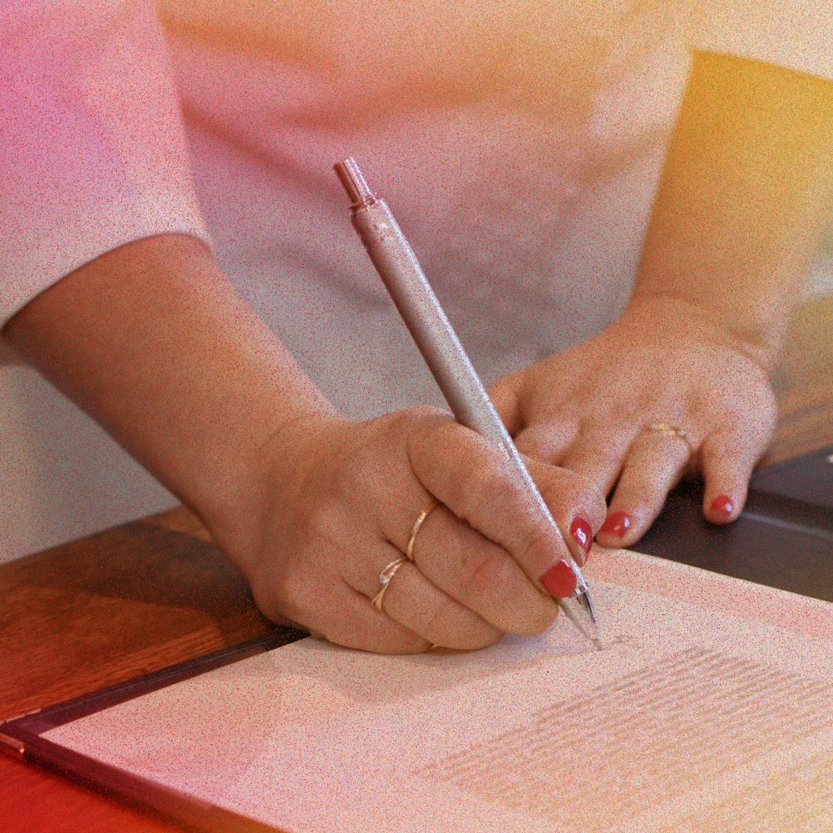 woman signing paperwork