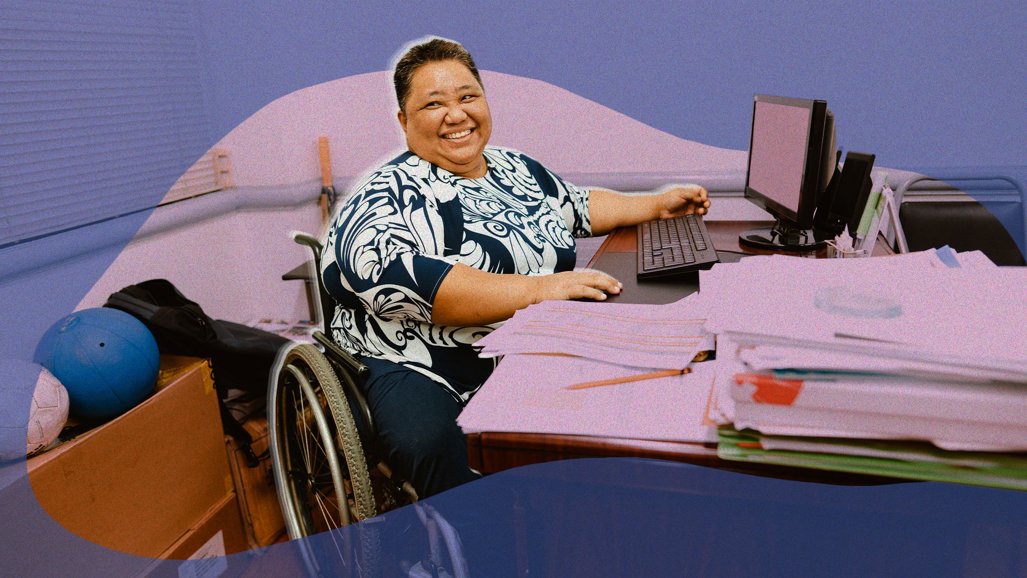 disabled person in a wheelchair working at a computer