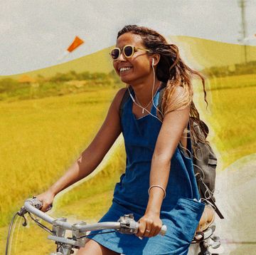 woman riding a bike smiling