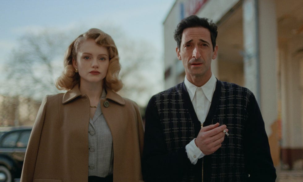 couple walking outdoors in vintage attire