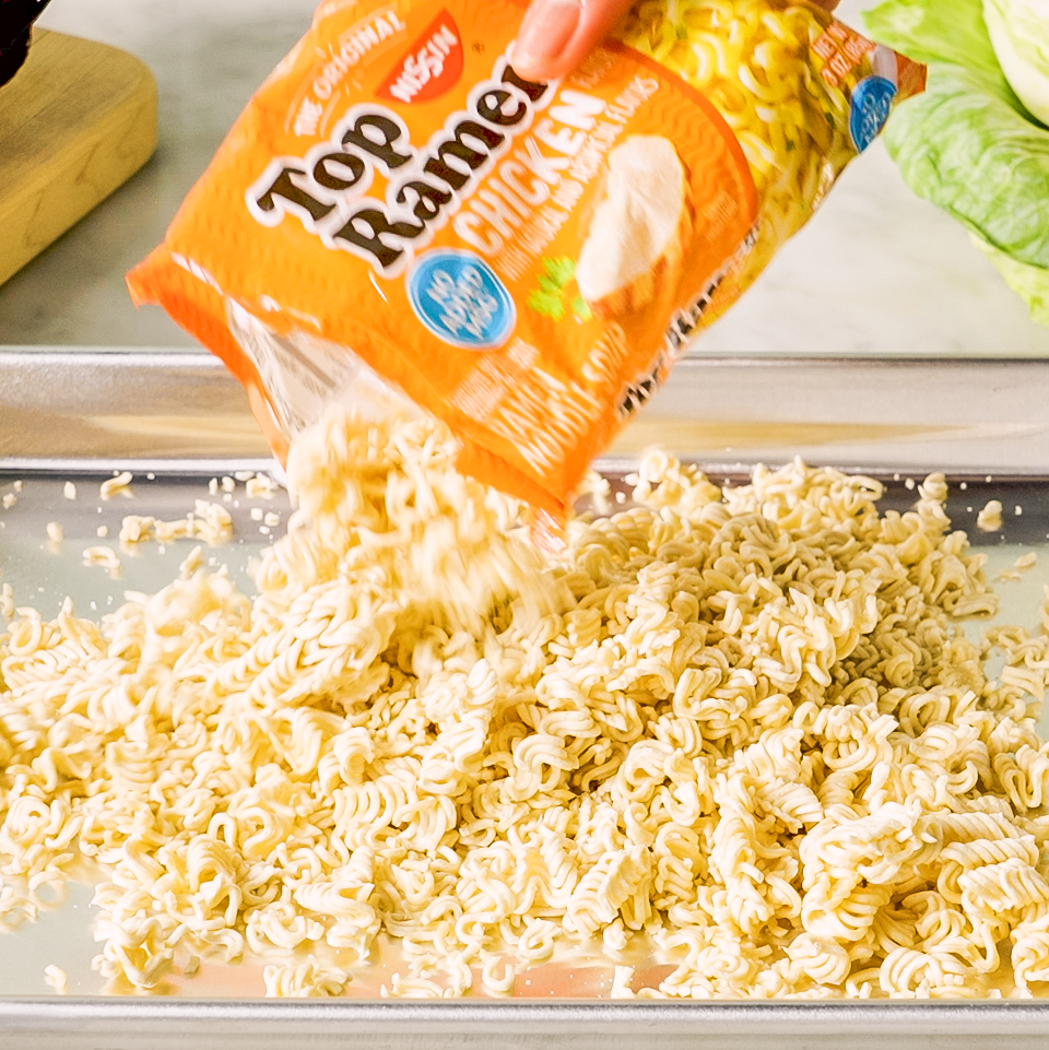 pouring ramen onto a baking sheet