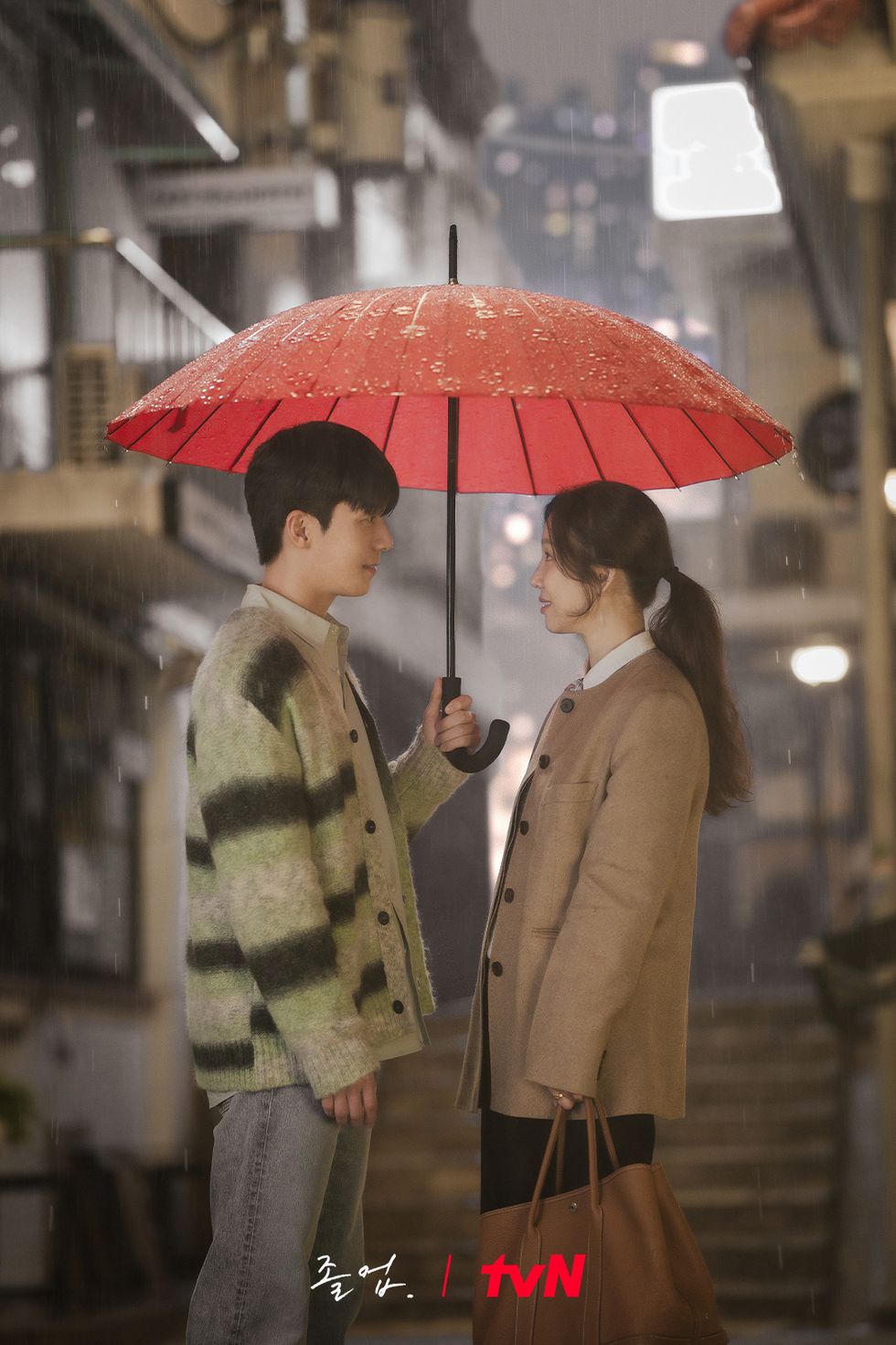 a woman and a man under an umbrella
