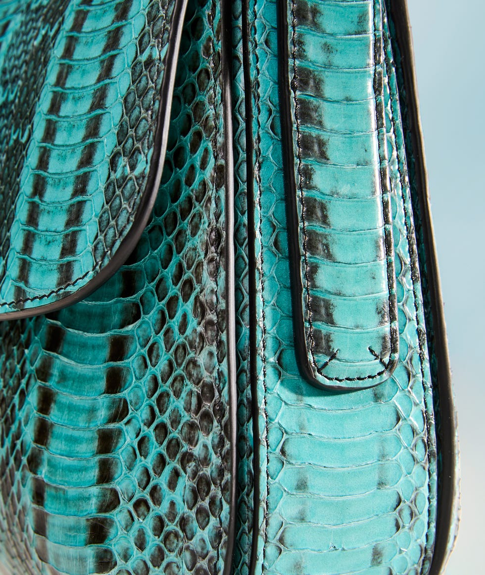 Stylish turquoise handbag made from snakeskin.