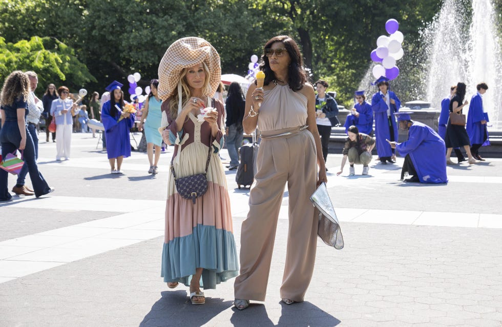 carrie and seema walk in the park in a scene from and just like that season 3 episode 1.