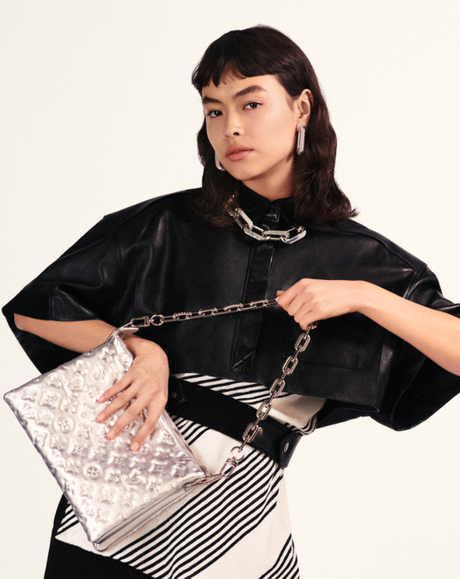 Louis Vuitton on X: #LVSS21 Reflective silver. The new Coussin bag from  @TWNGhesquiere's latest #LouisVuitton Collection tops quilted leather  compartments with a chunky chain strap. See more from the Fashion Show at