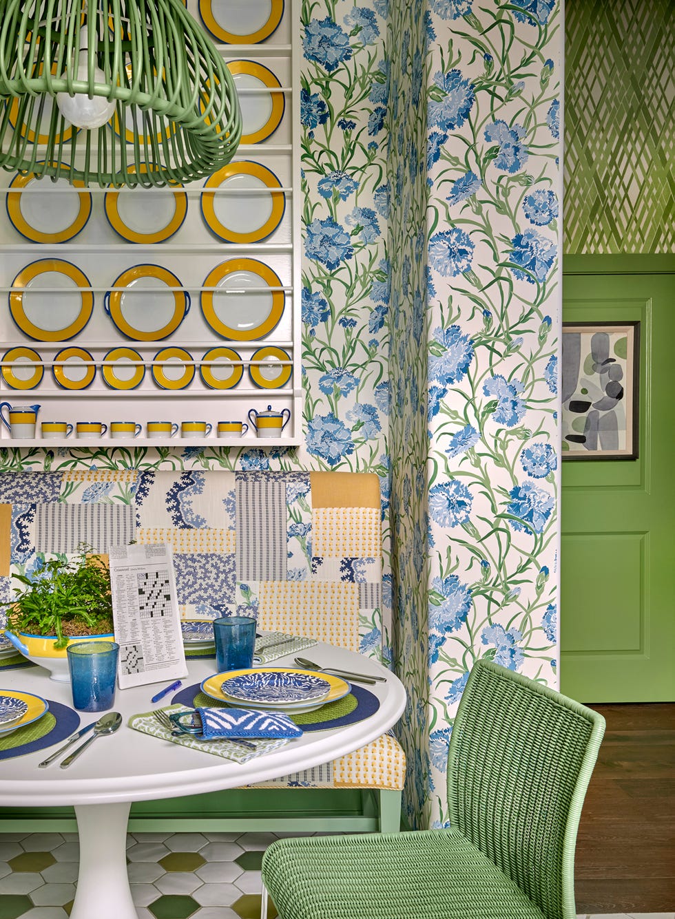 breakfast room with green seating, tiles, and light fixture.