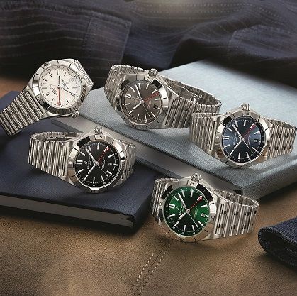breitling chronomat automatic gmt 40 from left to right white, black, anthracite, blue, green dialcmyk
