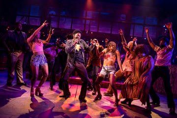 people dancing on stage performing the harder they come musical