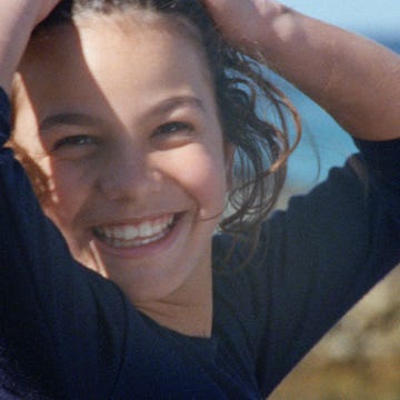 a woman with her hair in the air