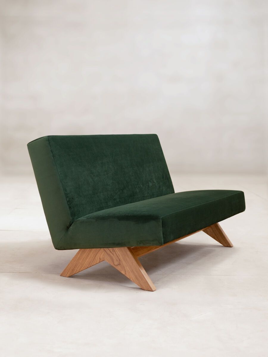 a green chair with a cushion