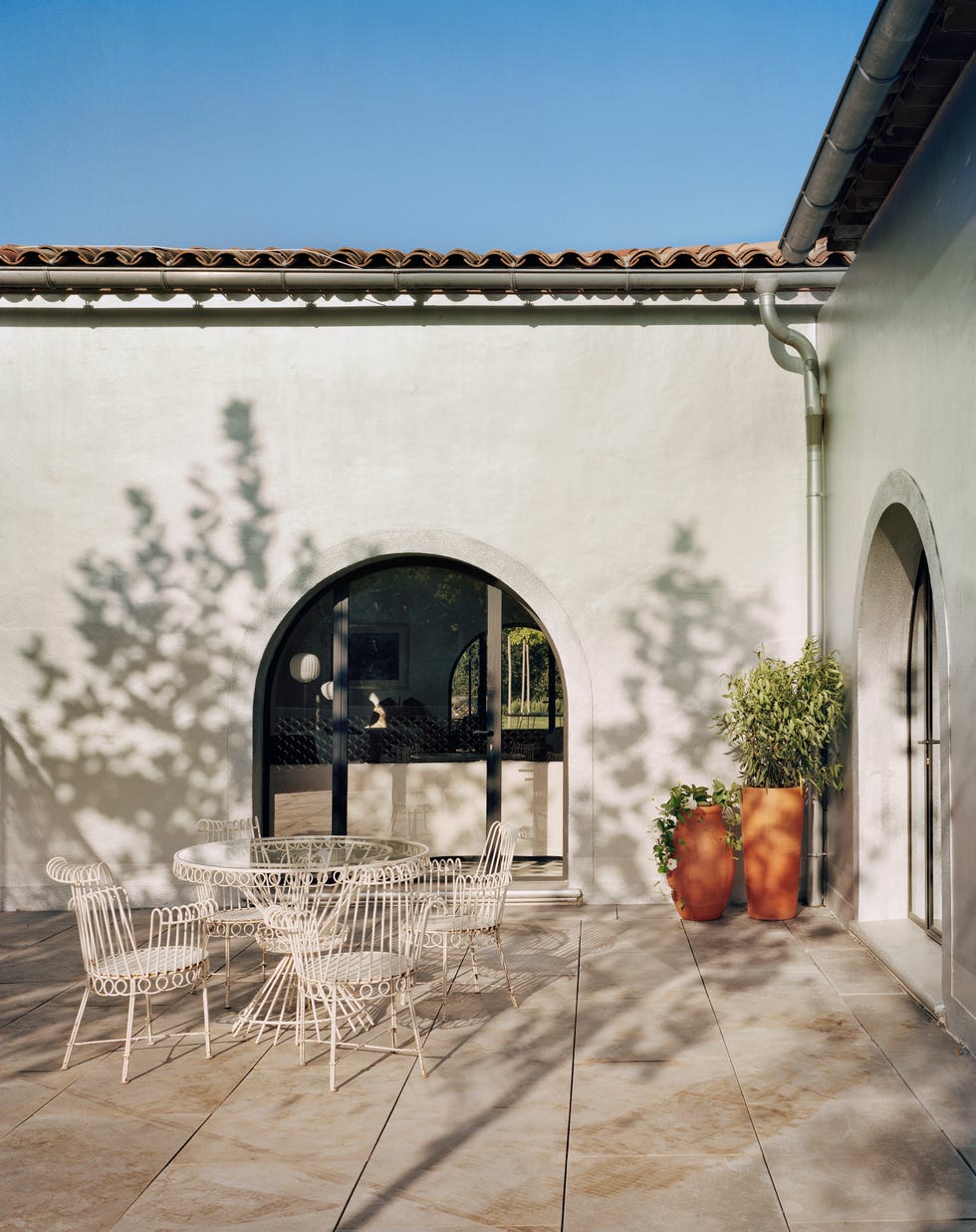 silver facade of domaine du’muy designed by india mahdavi
