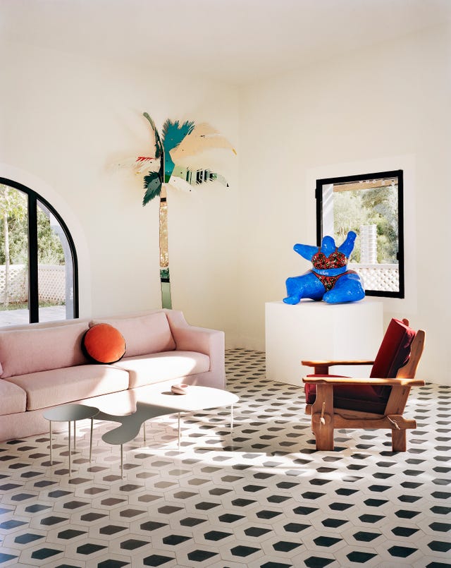 colourful living room by india mahdavi, featuring her ‘rain’ tiles for bisazza and a pink ‘jetlag’ sofa