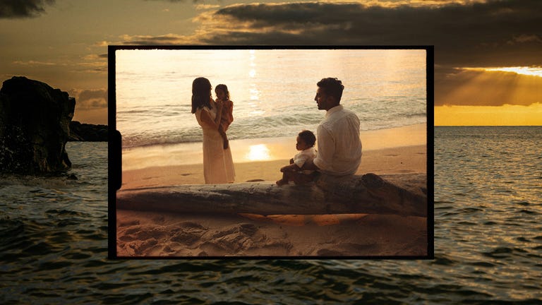 family at the beach during sunset