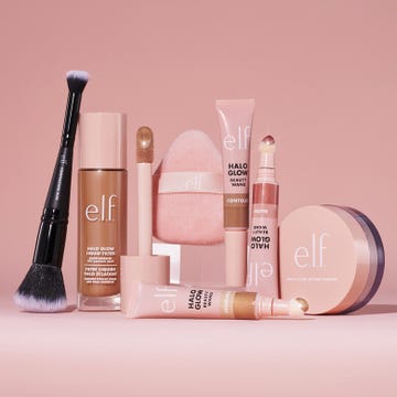 cosmetic products arranged on a pink background