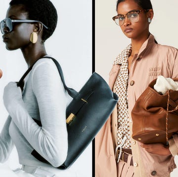 fashionable women holding designer handbags fashionable women holding designer handbags