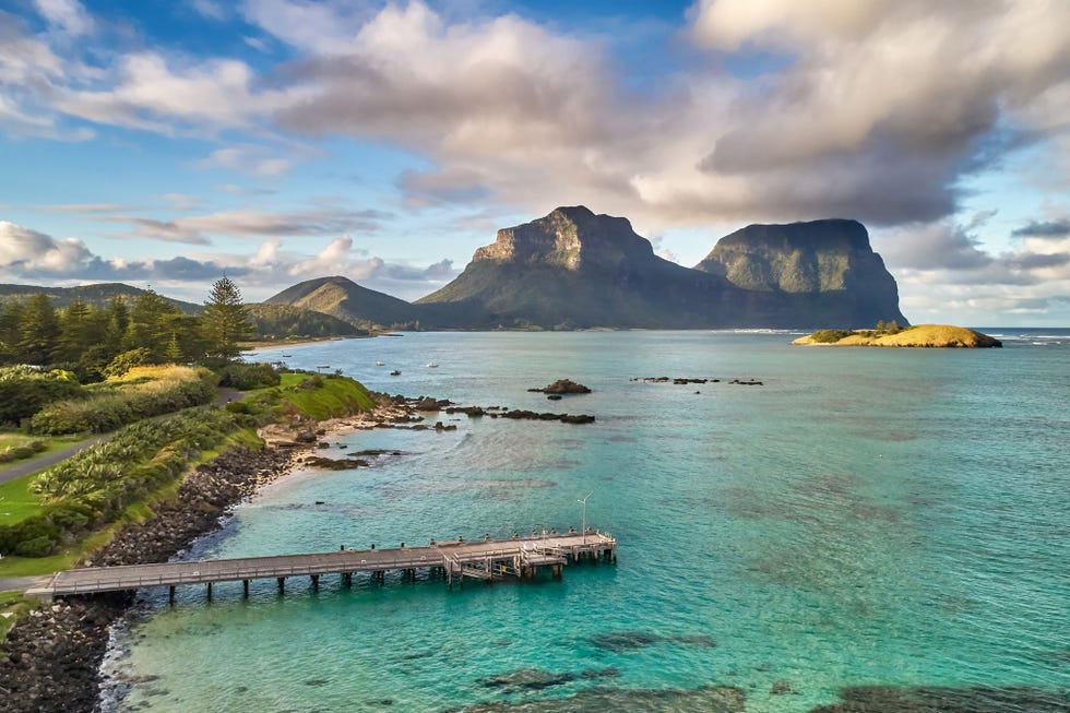 Mount Lidgbird rises over the lagoon at Lord Howe Island Australia Only 400 visitors are allowed at any one time to experience the natural wonders of this UNESCO World Heritage site