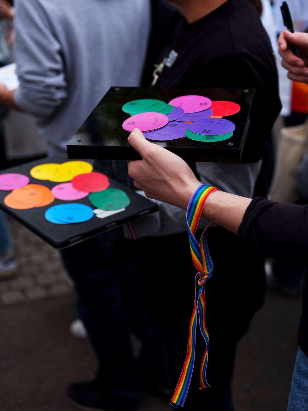 a person holding a device with colorful circles on it