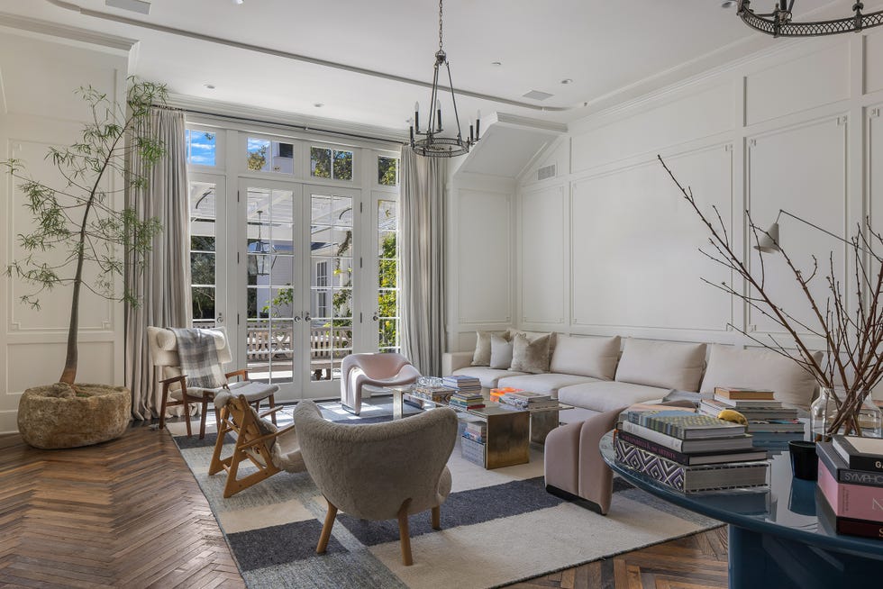 a living room with a couch and chairs
