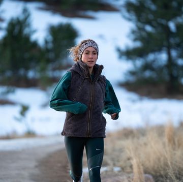 how cold is too cold to run a woman navy running in the winter along a snowy path
