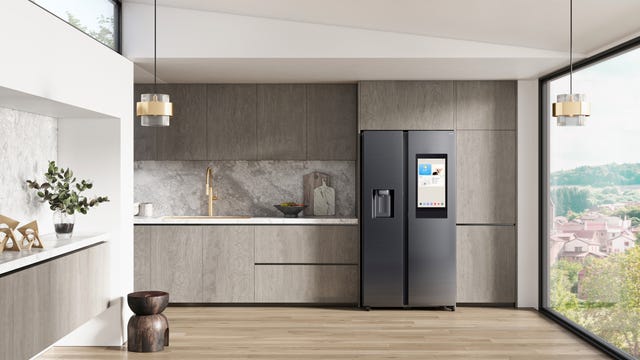 modern kitchen setting with a sleek refrigerator and natural light