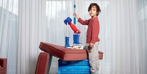 a child standing on a toy